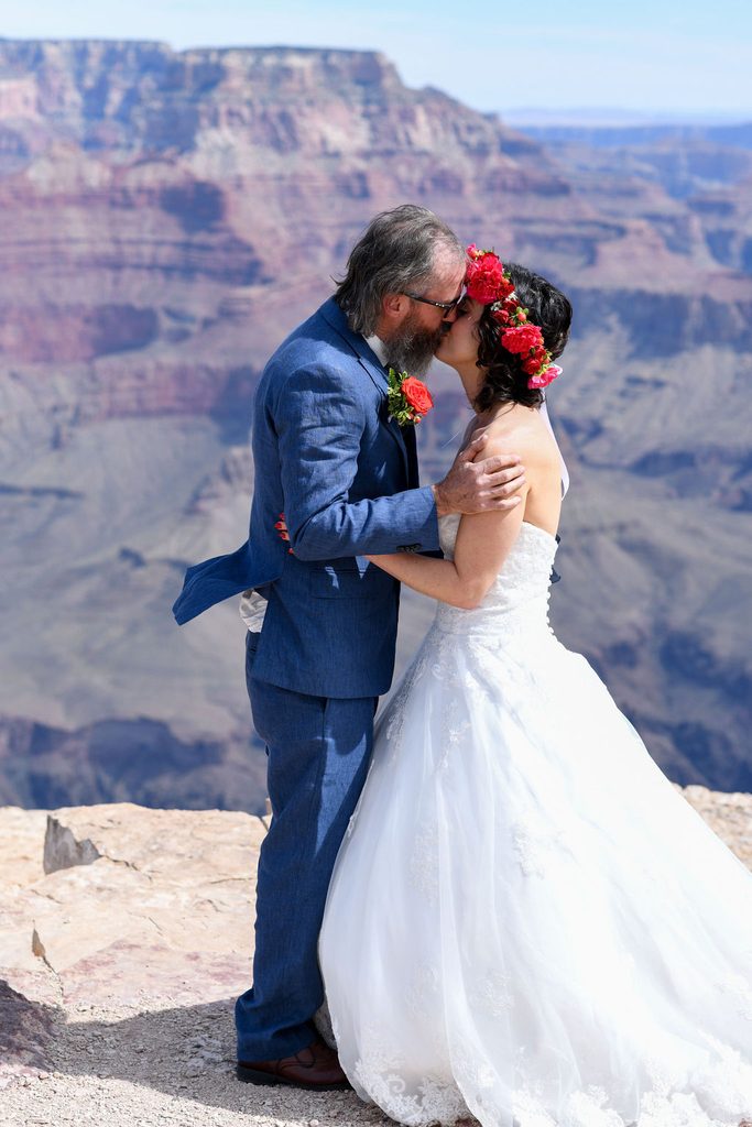 couple kisses at overlook