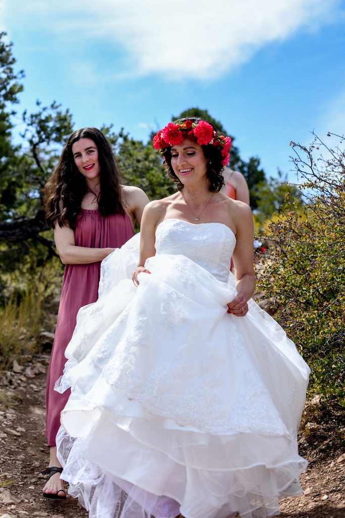 bride walks on rocky terrain 
