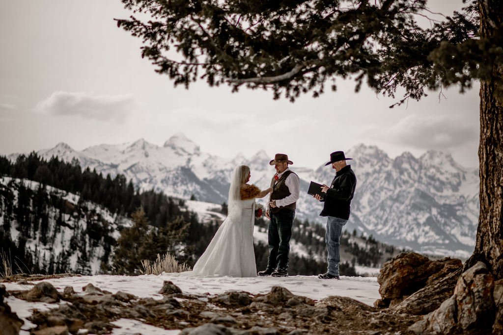 couple has Grand Teton elopement ceremony in front of the Wedding Tree