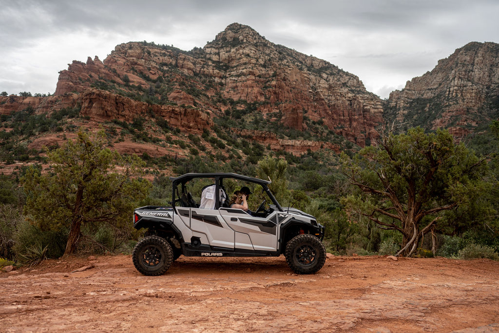 couple in 4x4 during sedona alternative wedding