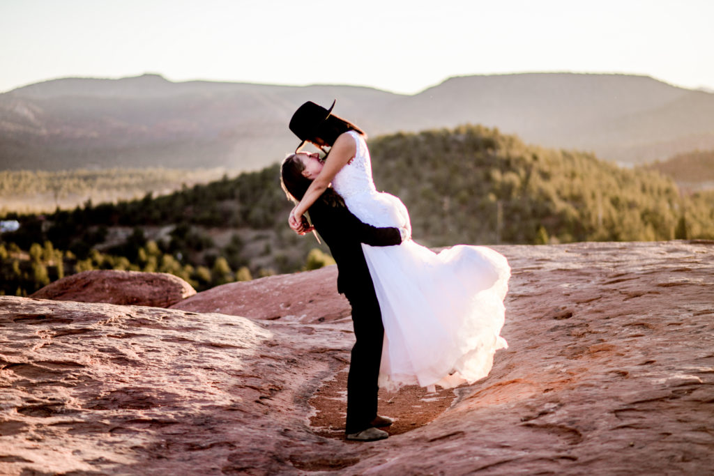 couple pose during sedona alternative wedding