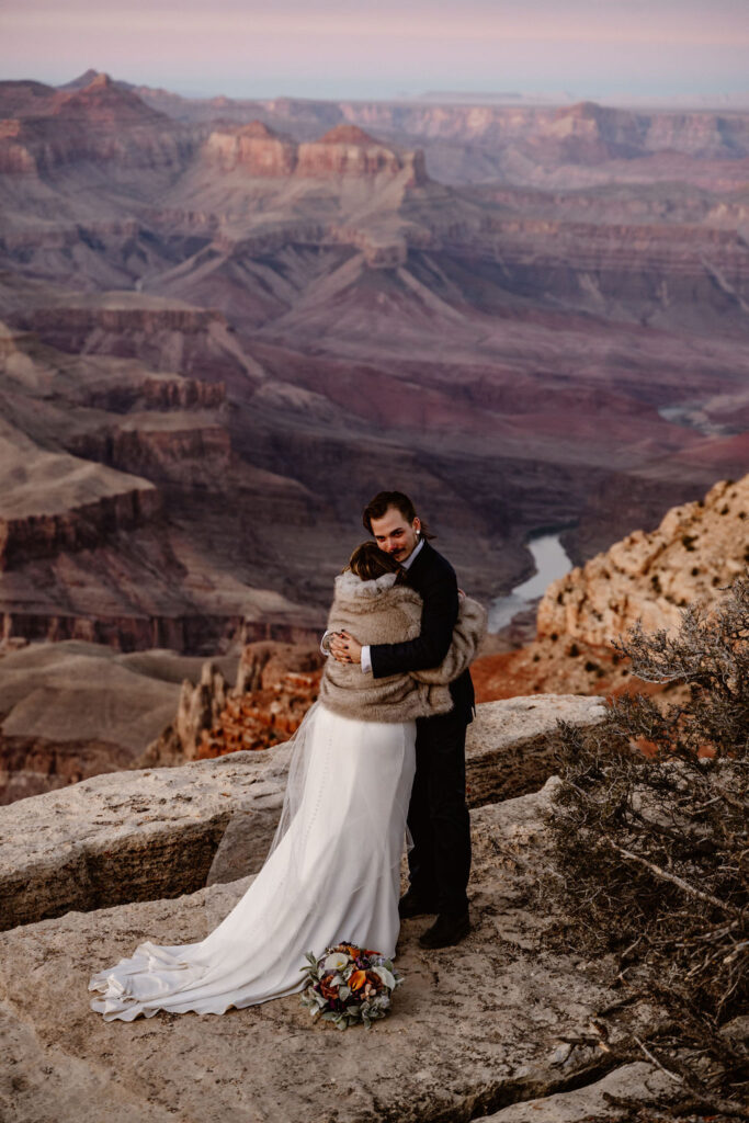 couple embraces at grand canyon elopement