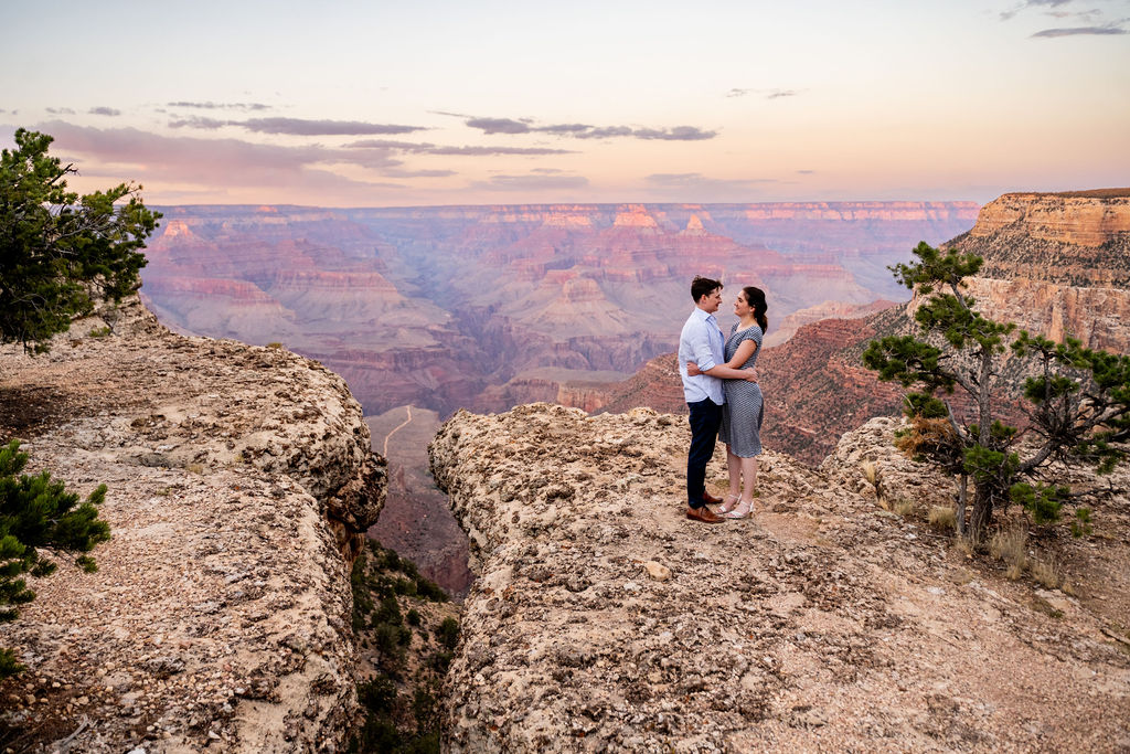 couple embraces at Grand Canyon engagement session