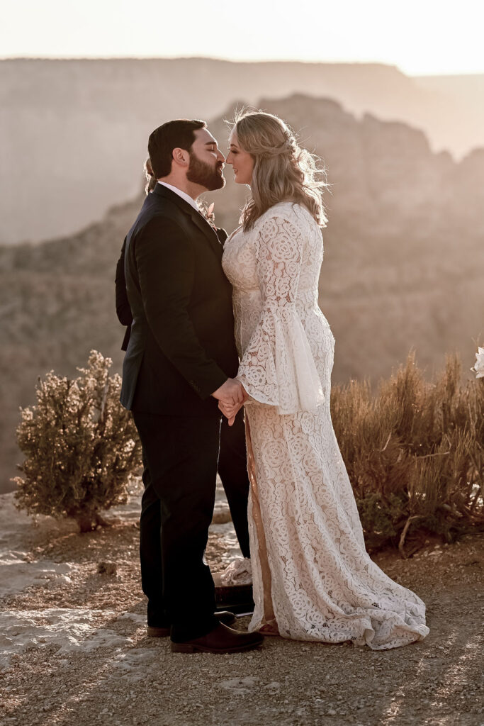 couple kisses at Grand Canyon sunset elopement