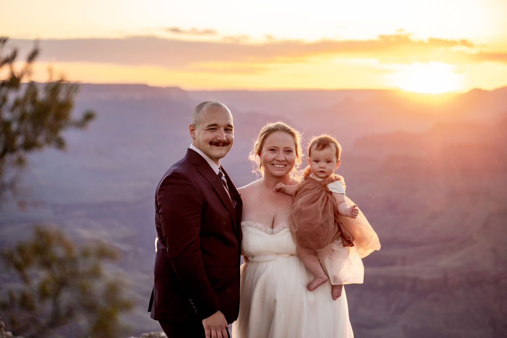 couple posing with daughter during Grand Canyon Elopement