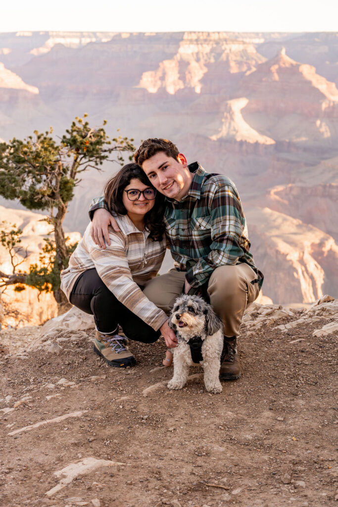 couples pose together with their dogs at the Grand Canyon