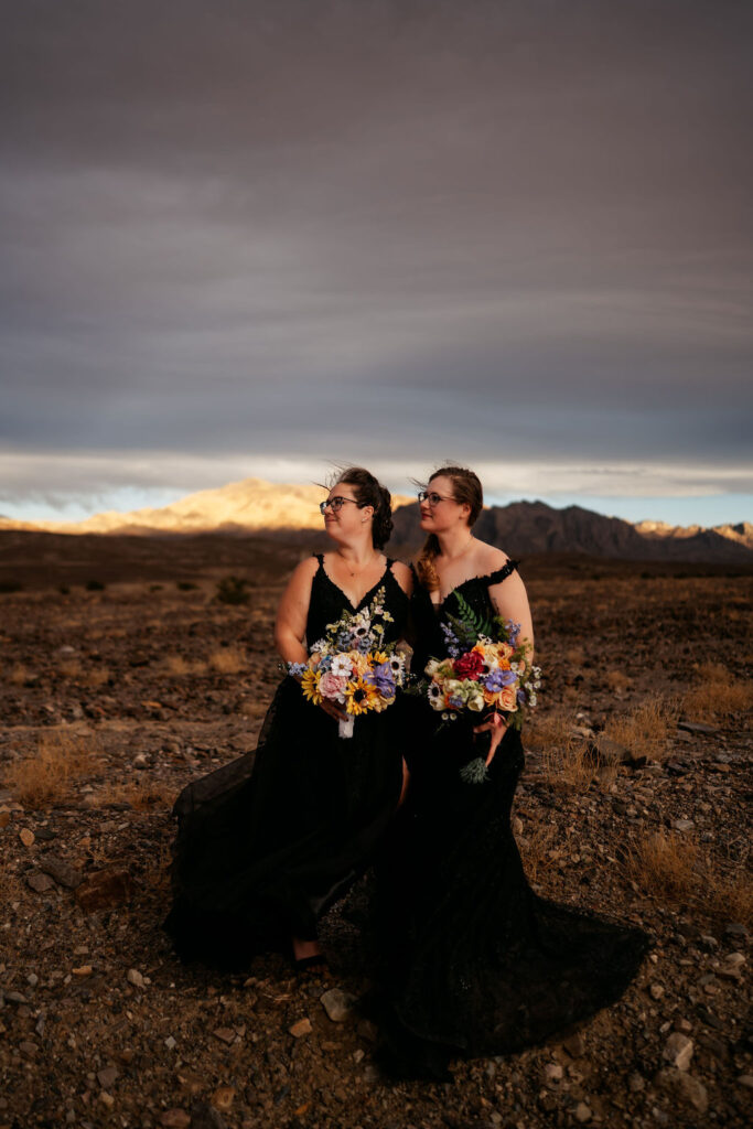 couple take Death Valley photos in black elopement dresses
