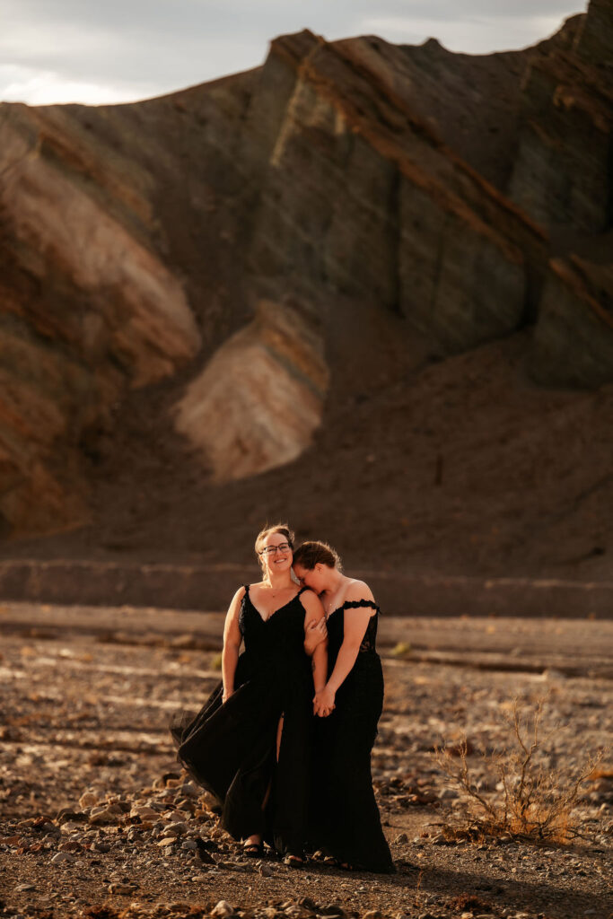 couple take Death Valley photos in black elopement dresses