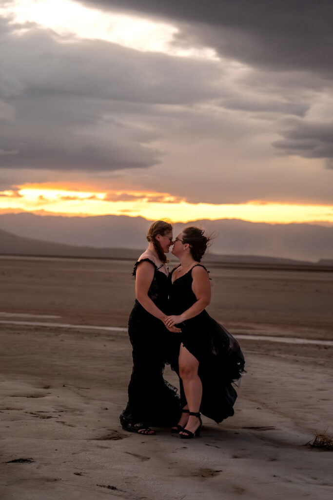 couple kiss on salt flat after elopement ceremony