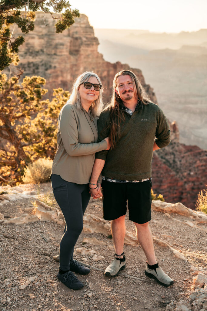 couple posing on rocky ledge