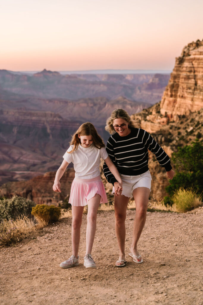 mom and daughter walking hand in hand