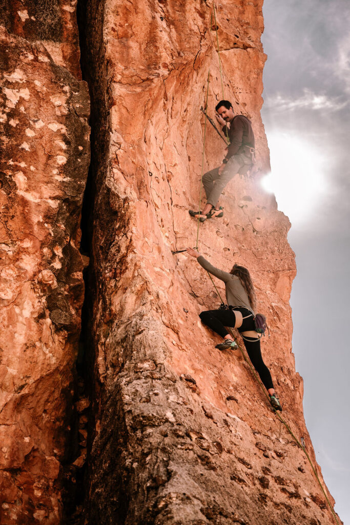 couple do a rock climbing adventure session in Page Arizona