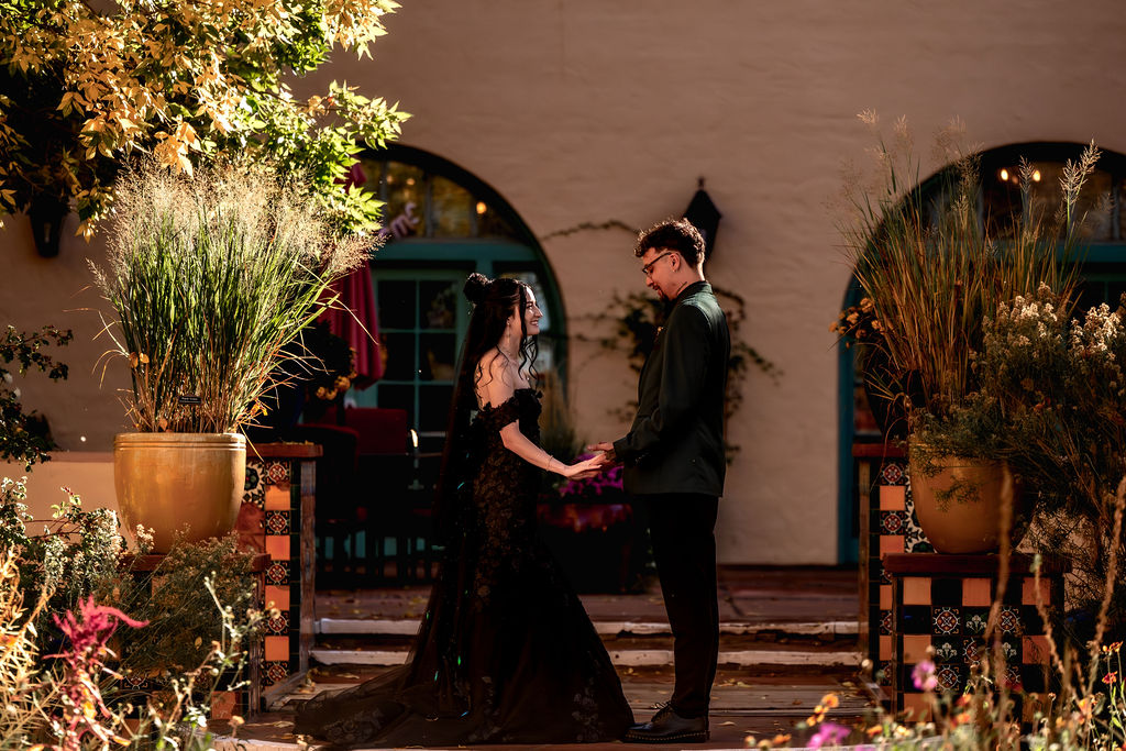 couple pose along path in the garden at the La Posada hotel