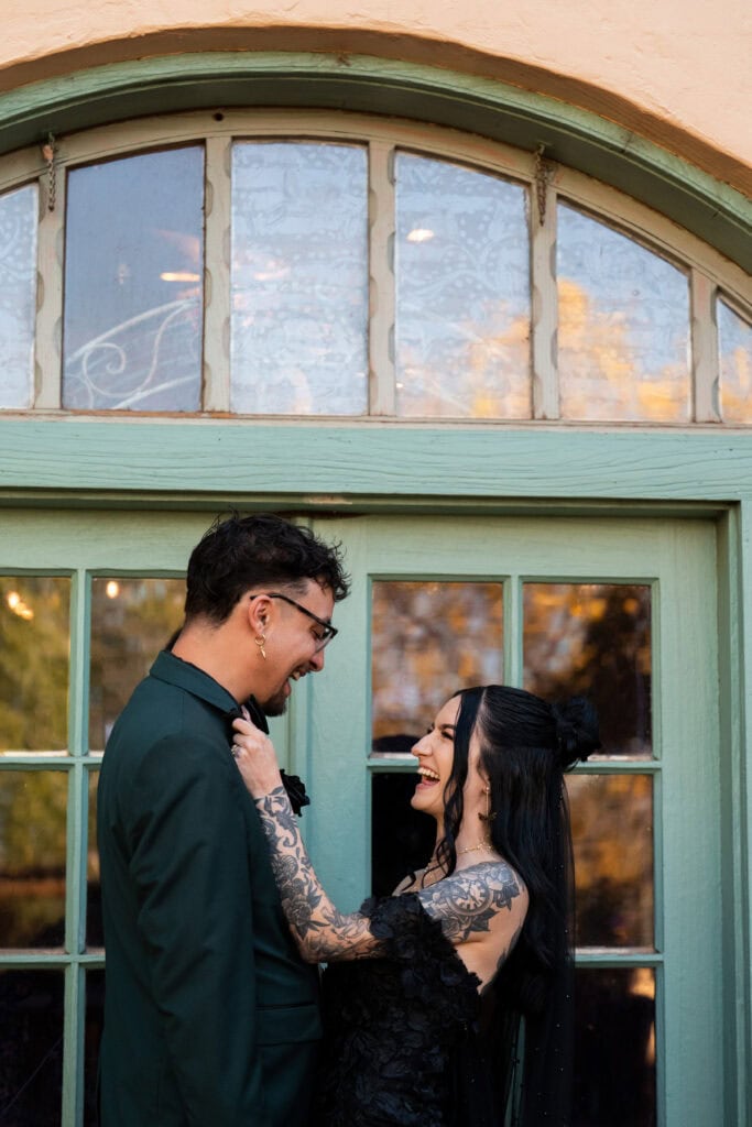 couple laughing together while doing first look