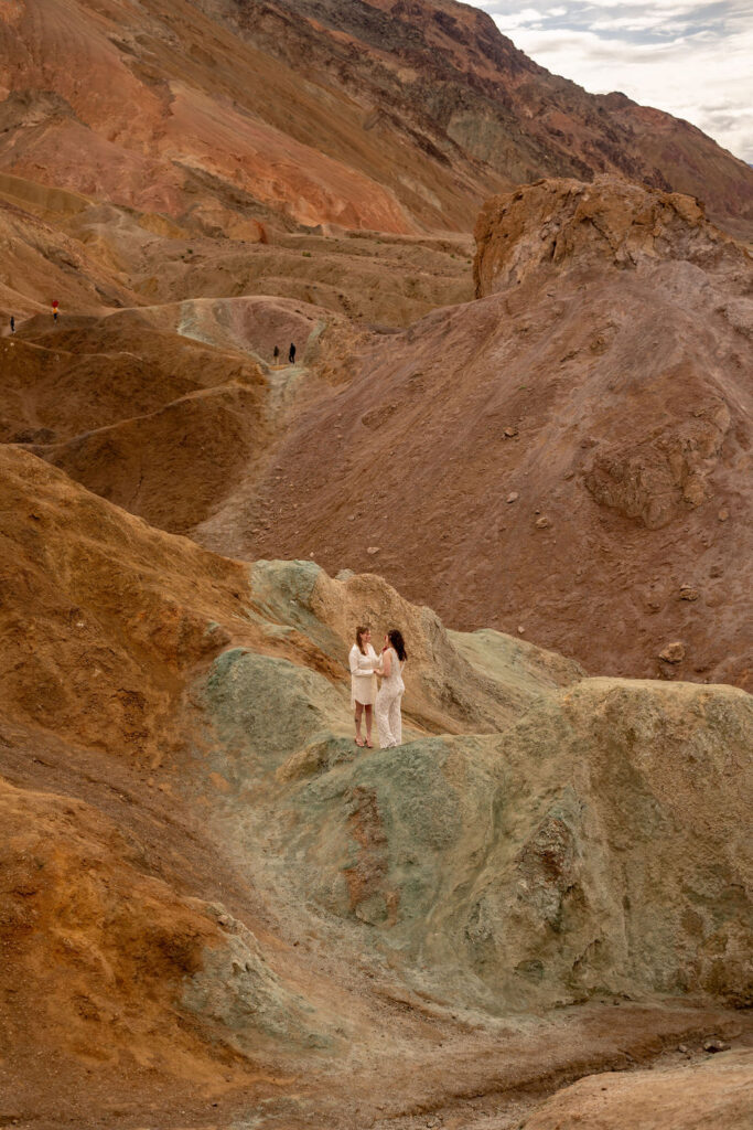 couple poses within the rocks during their death valley trip