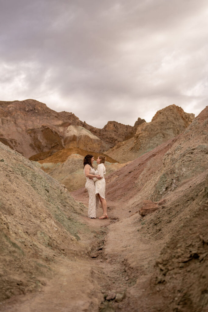 couple poses within the rocks during their death valley trip