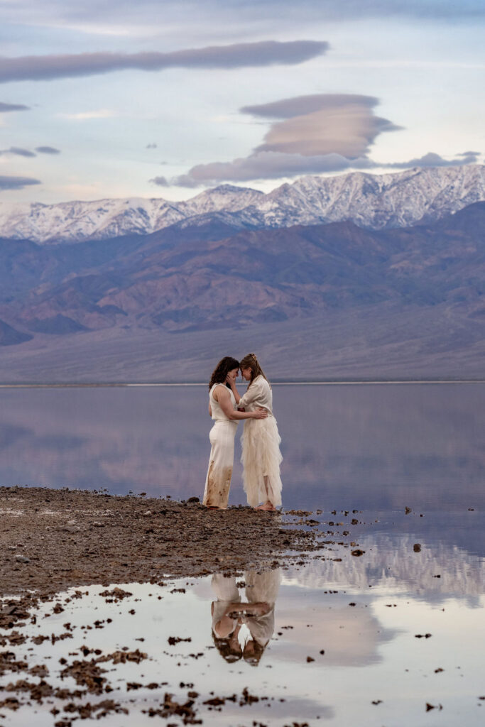 couple embrace while in the water 