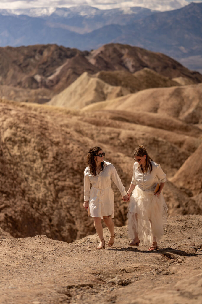 couple walking along rocky path