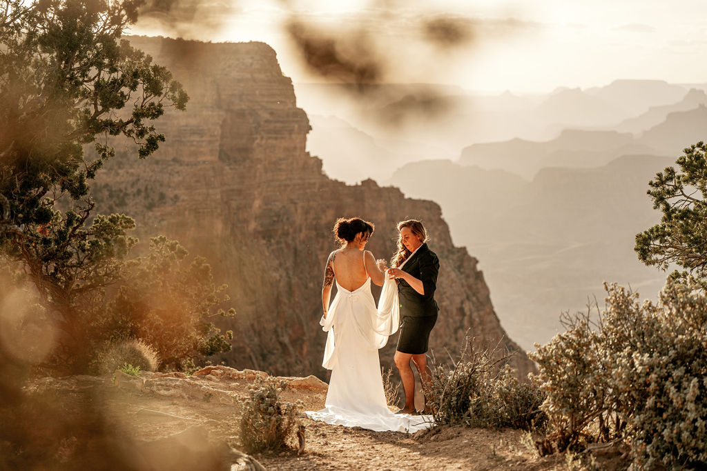 assistant helping bride get ready