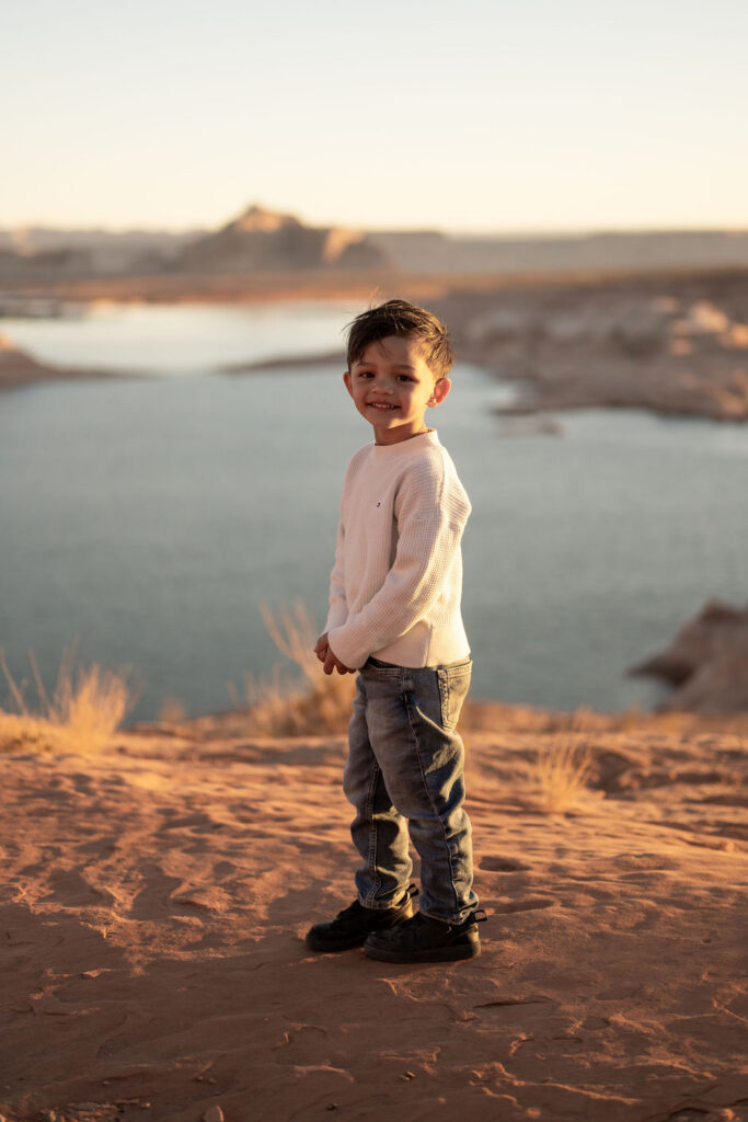 child posing by water