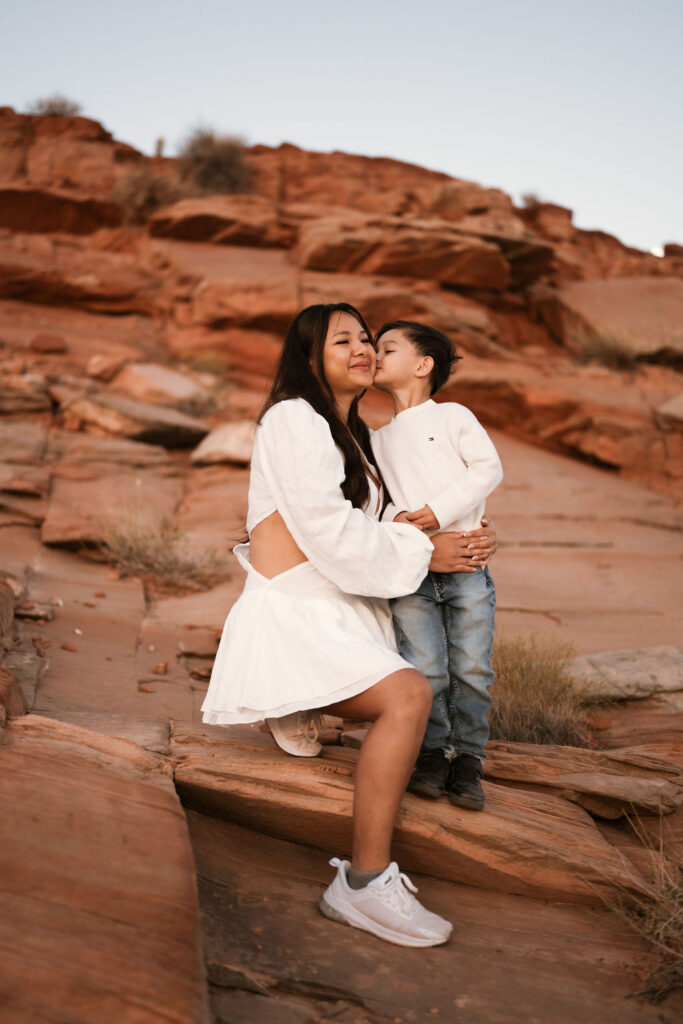 little boy kissing mother