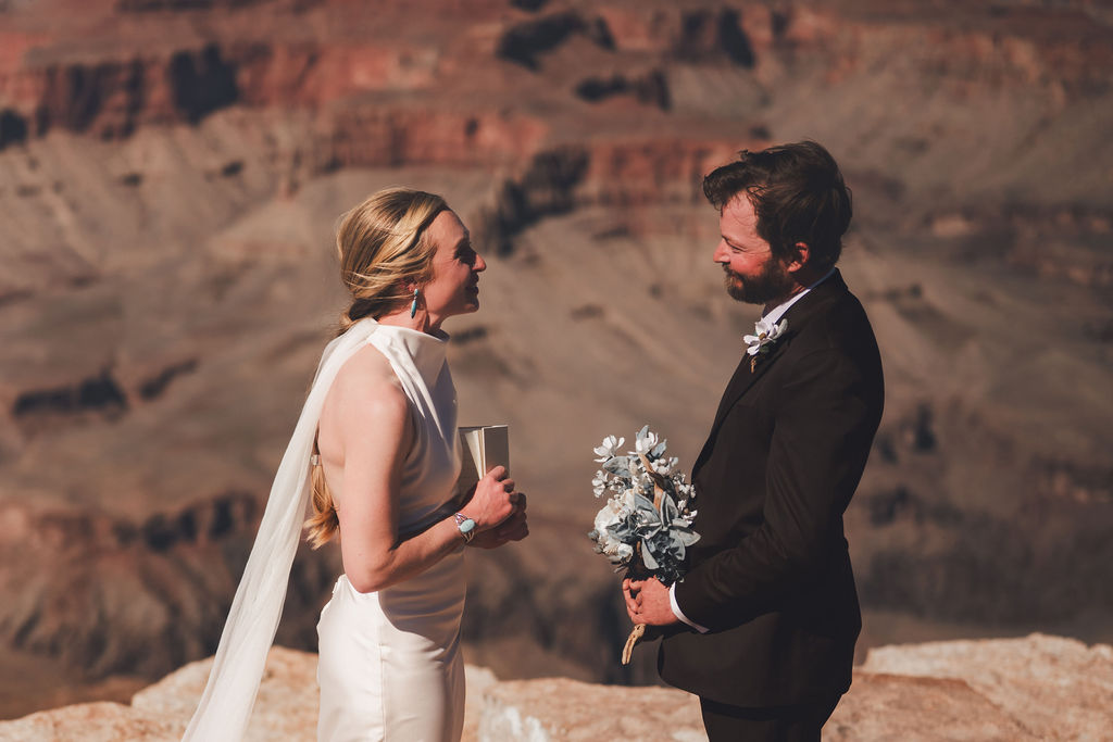 couple reading vows to one another