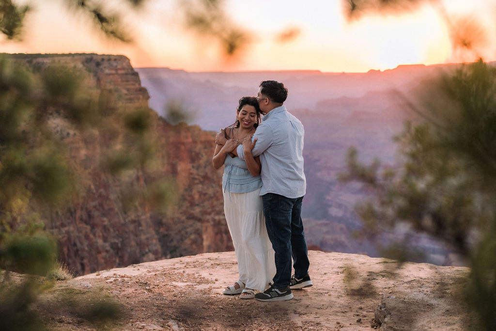 couple embrace at sunset
