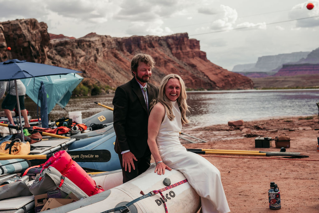 couple posing on boat at the Lees Ferry during Grand Canyon adventure