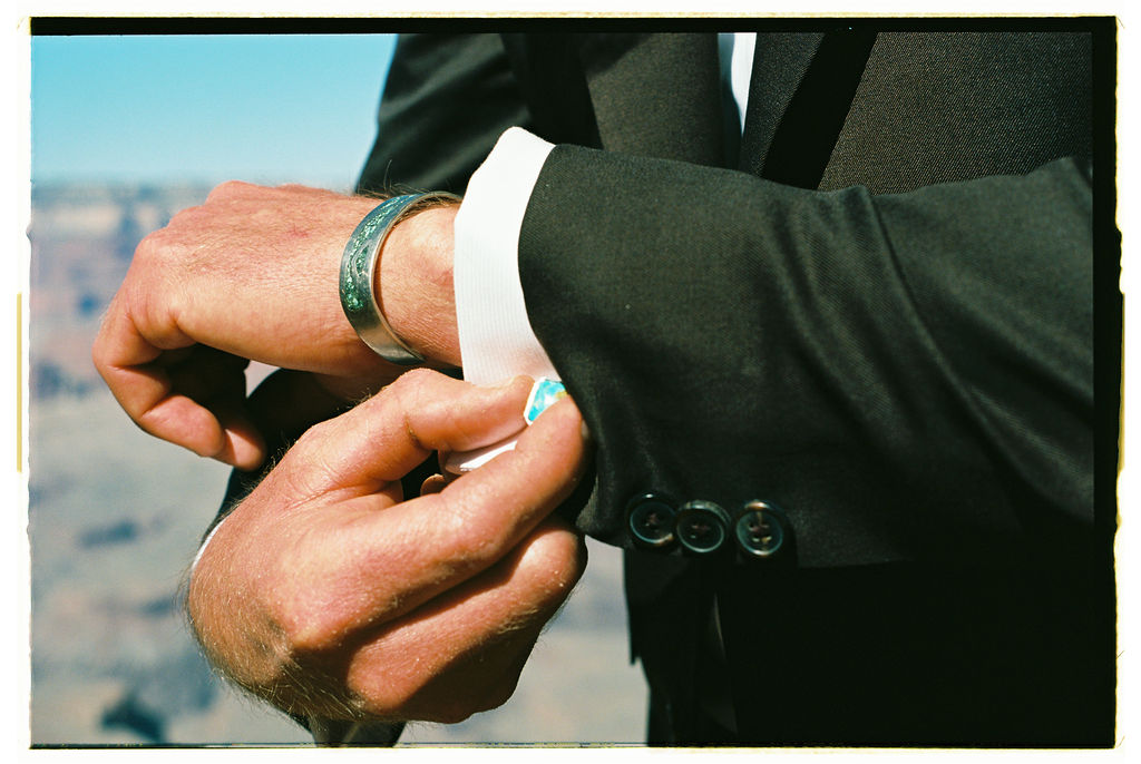 detail shot of groom getting ready