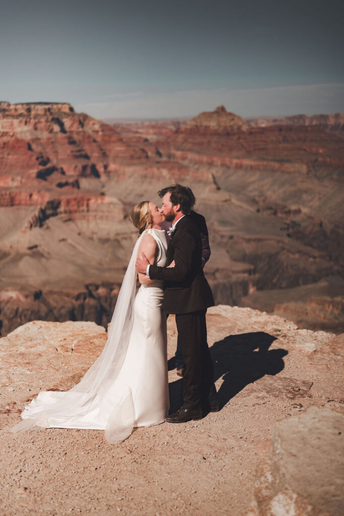 couple kisses at Grand Canyon elopement ceremony