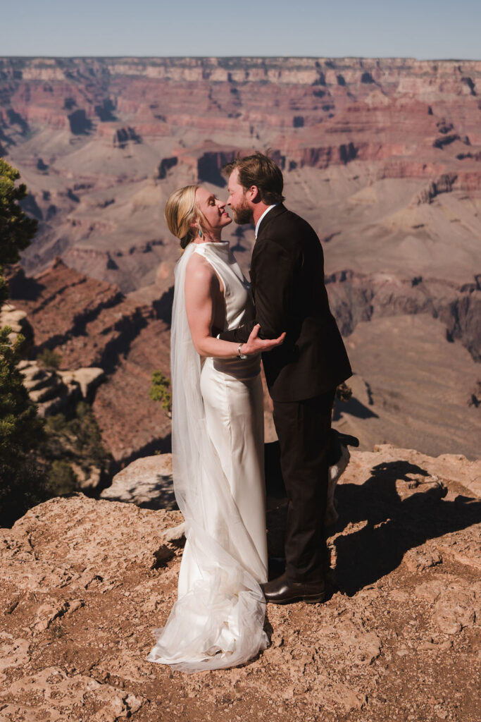 couple kisses at Grand Canyon elopement