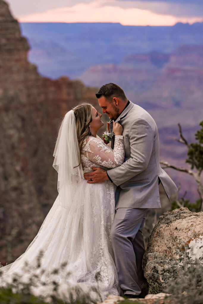 couple embraces at Grand Canyon elopement