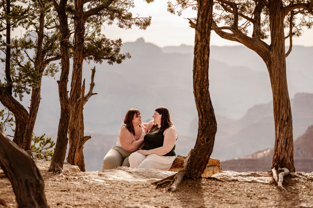 couple sits at overlook