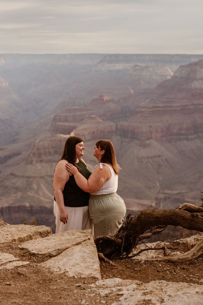 couple stands at sunrise overlook
