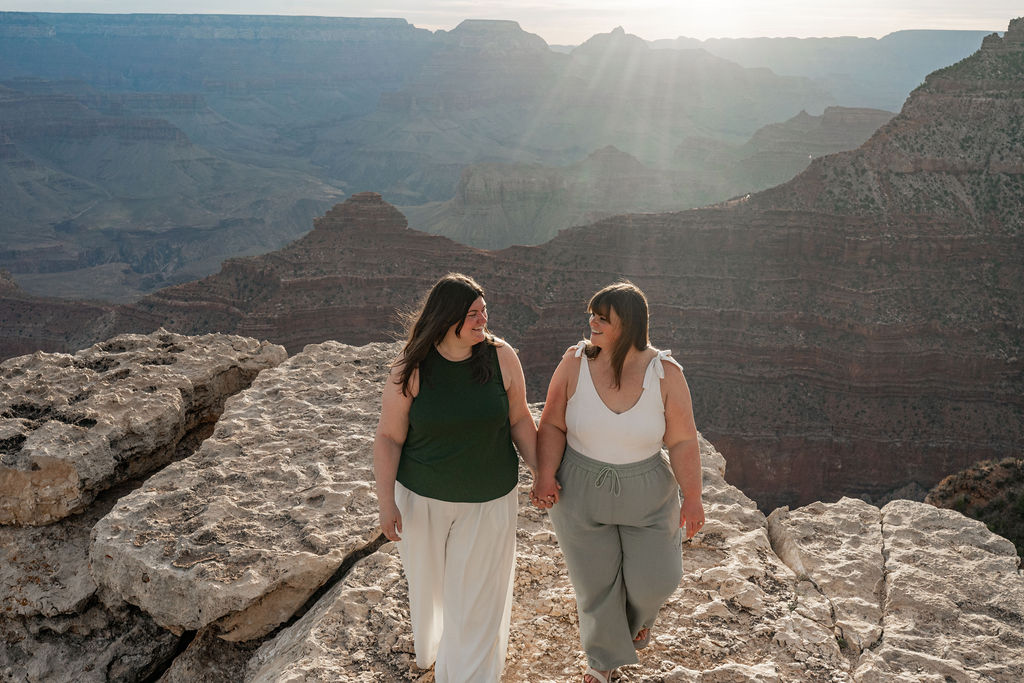 couples holding hands on overlook