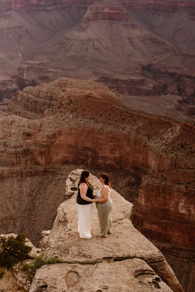 couple stands at Grand Canyon sunrise overlook