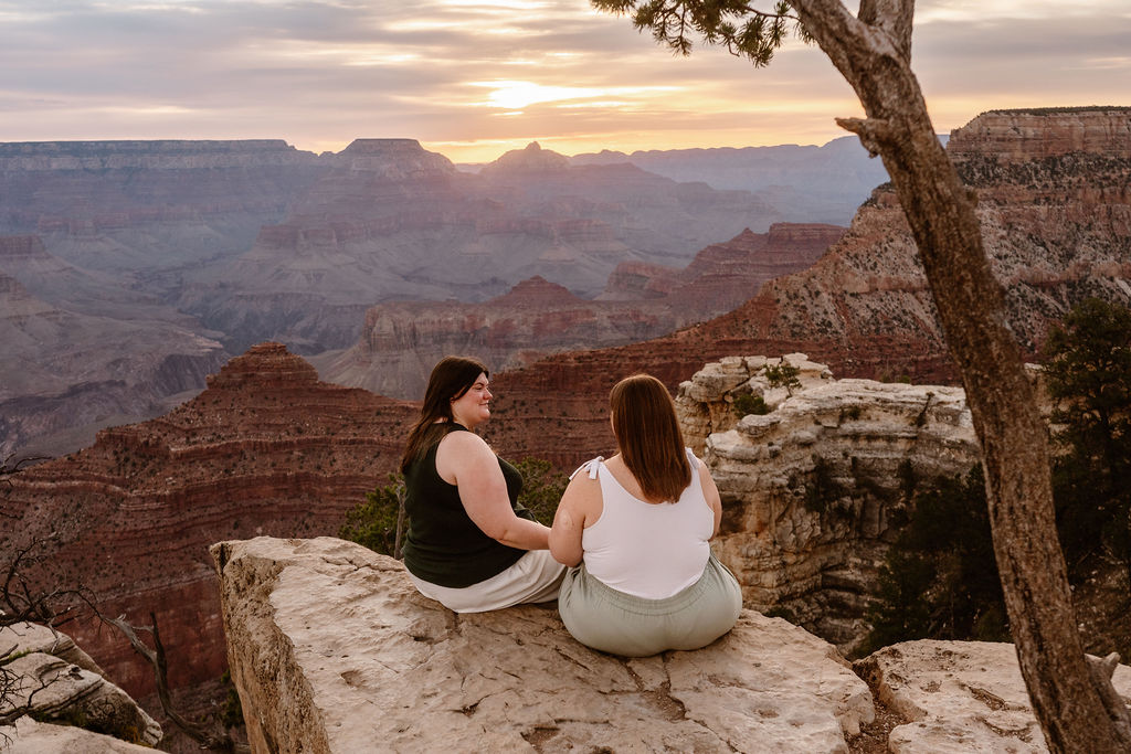 couple sits on overlook
