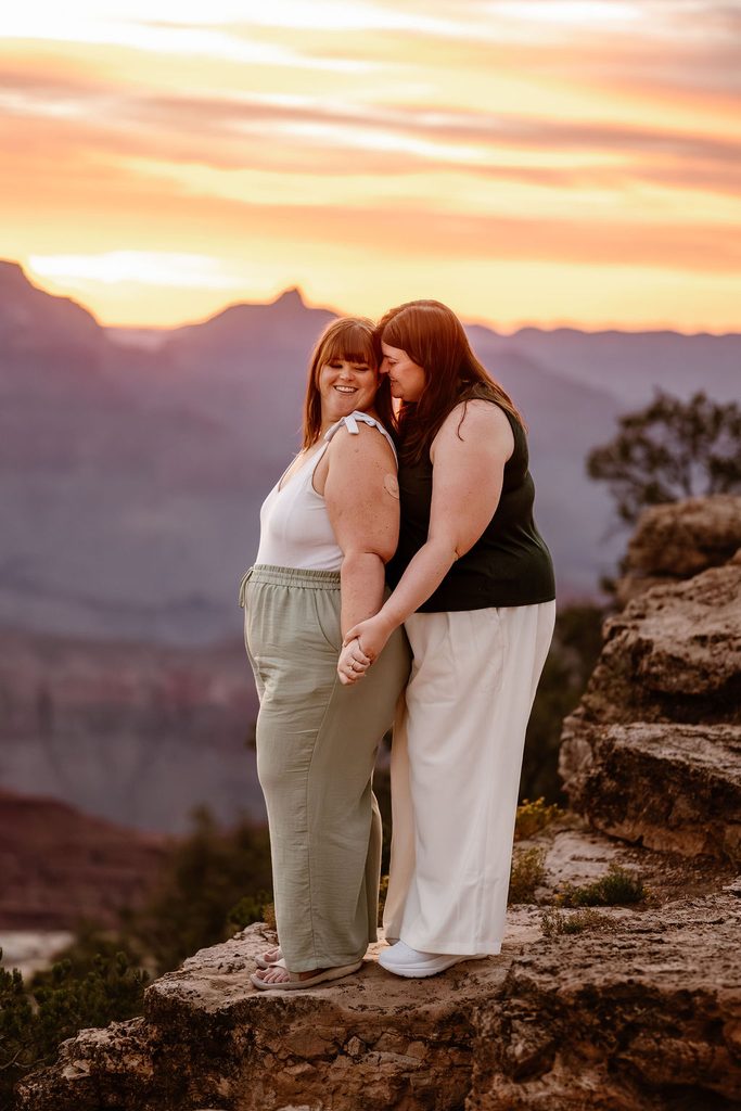 couple embraces on sunrise overlook