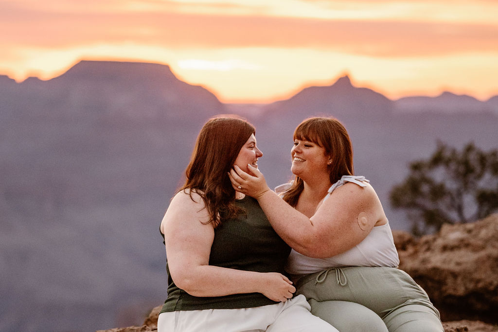 couple embraces at Grand Canyon proposal